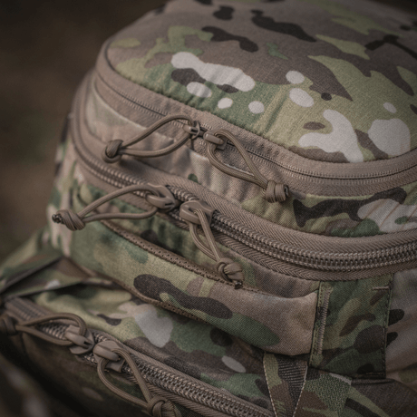 Detaljer av M-Tac Ryggsäck Large Gen.IV Elite i kamouflagedesign med robusta dragkedjor, tillverkad av slitstark Cordura för hållbarhet.