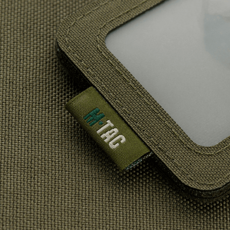M-Tac taktisk ID-korthållare med snöre på solid Cordura-material, idealisk för militärt och polisbruk, med transparent fönster och extra hållbarhet.