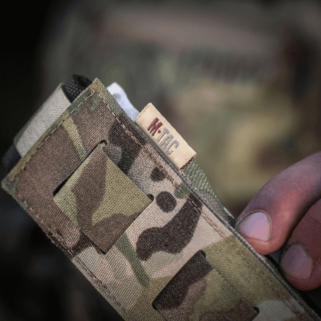 M-Tac Tourniquet Pouch Elastisk med MOLLE Gen.II i kamouflagemönster av Cordura-material för säker förvaring.