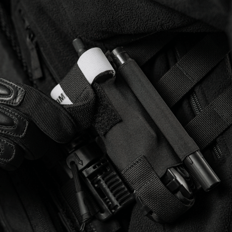 M-Tac Elastisk Tourniquet Pouch Molle Gen.III, ficka på en taktisk väst.
