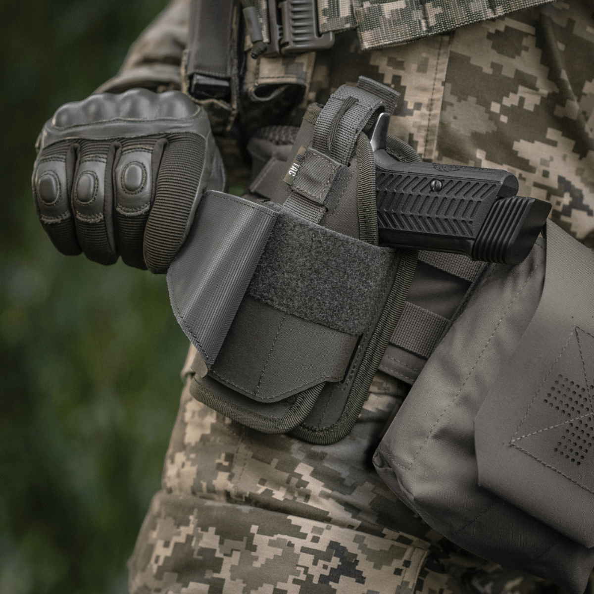 M-Tac Universal Taktisk Hylster Elite Venstre tilpasset Glock, lavet af Cordura 500D og monteret via MOLLE-interface.