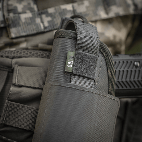 M-Tac universal taktiskt hölster Elite Vänster i laminerad Cordura 500D med NIJ-certifiering, justerbar storlek, galleri position 1.