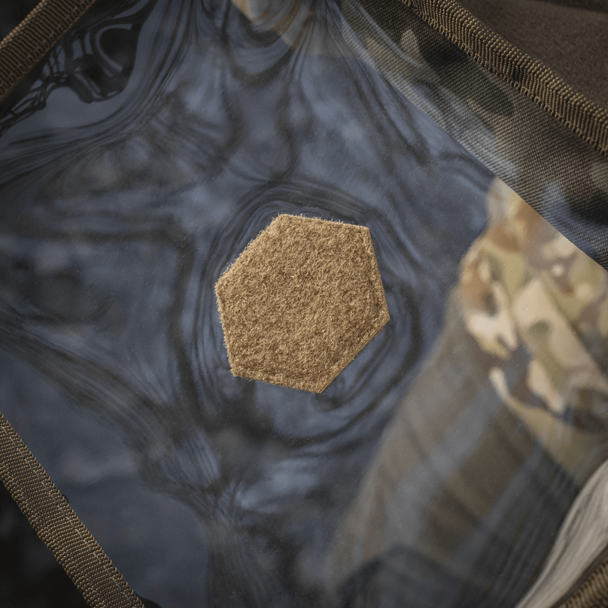 Detalje af M-Tac Utility Organizer Slim Elite, der viser den transparente PVC-folie til hurtig genstandsidentifikation.