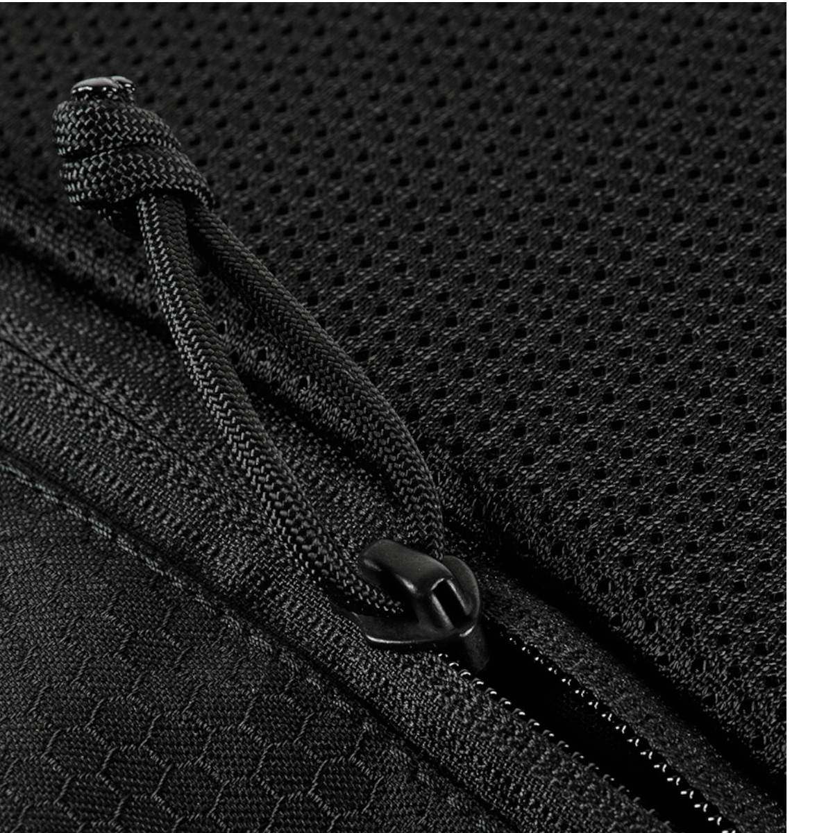 Detalje af lynlås og materiale på M-Tac Konvert Taske Elite i sort Cordura 500D og Cordura Hex 1000D.