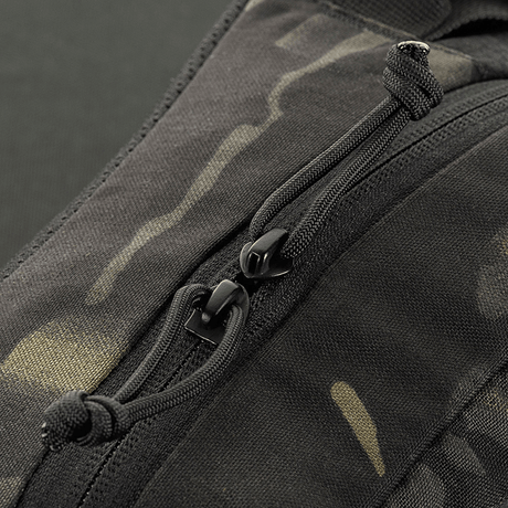 Närbild av M‑Tac bältesväska Elite Hex med YKK-dragkedja på Cordura 500D, visar taktisk design och hållbarhet.