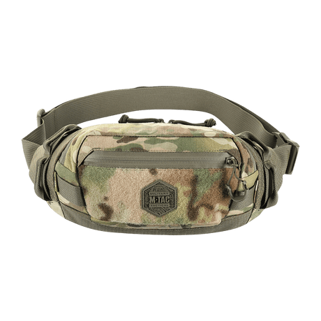 M‑Tac bältesväska Elite Hex i camouflagemönster, gjord av Cordura, med YKK-dragkedjor och Woojin-spännen, perfekt för vardag eller taktisk användning.