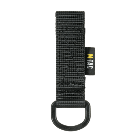 M-Tac fäste med D-ring för MOLLE-system, kompakt och lätt för taktisk användning med Velcro-stängning. Funktionellt tillbehör för utrustning.