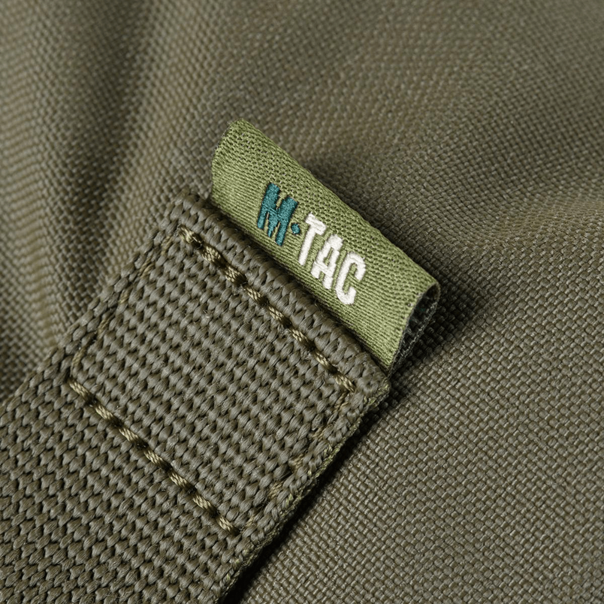 Detalje af M-Tac Pouch Sukharka Gen.3 XL med holdbart Cordura 500D materiale og M-Tac logo syning.
