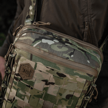 M-Tac Tablet Bag Laser Cut Hex i camouflage, lavet af Cordura med Laser Cut MOLLE panel til ekstraudstyr. Perfekt til EDC og skjult bæring.