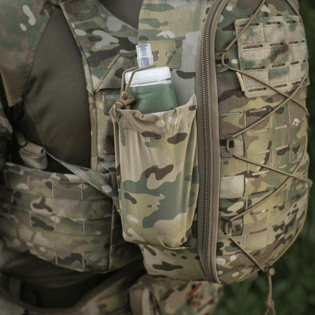 M-Tac STURM Elite Rygsæk med elastisk sidelomme og camouflagedesign, perfekt til kortvarige missioner. Taktisk rygsæk til nødvendigt udstyr.