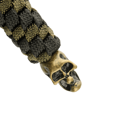 M-Tac Knife Lanyard Helix Skull i flätad paracord med metallskalle, utformad för att ge stil och funktion åt fickknivar.