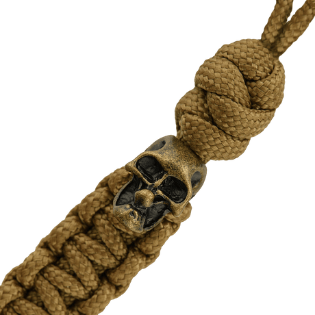 M-Tac Loopy Snake Skull Lanyard i flätad paracord, designad för knivar och utrustning, med dekorativ dödskalle.