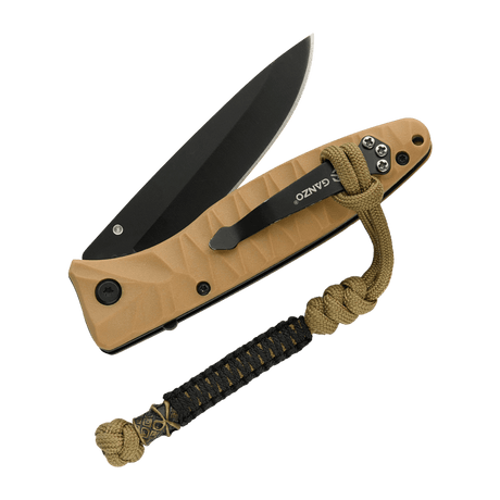 M-Tac Ninja Ver.2 Lanyard fäst vid en kniv med flätad paracord-design och ninjamotiv, idealisk för knivar och små verktyg.