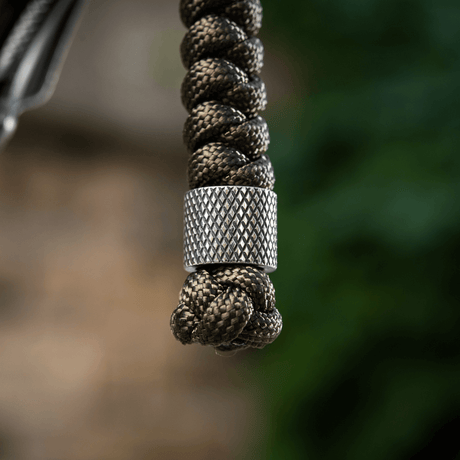 M-Tac Viper Lanyard Stainless Steel med flätad paracord och pärla i rostfritt stål, flexibelt knivtillbehör för snabb åtkomst.