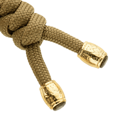M-Tac Zeus Lanyard i flätad paracord med stilfulla guldförsedda ändar, perfekt för knivar, ficklampor och utrustning. Flexibel förlängning för snabb åtkomst.