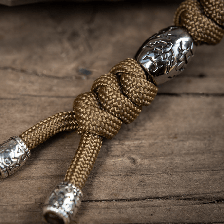 M-Tac Zeus Stainless Steel Lanyard med flätad paracord och dekorativa pärlor, perfekt för kniv eller utrustning.