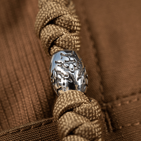 M-Tac Zeus Stainless Steel Lanyard med flätad paracord och dekorativ pärla, idealisk för snabb åtkomst till kniv och utrustning.