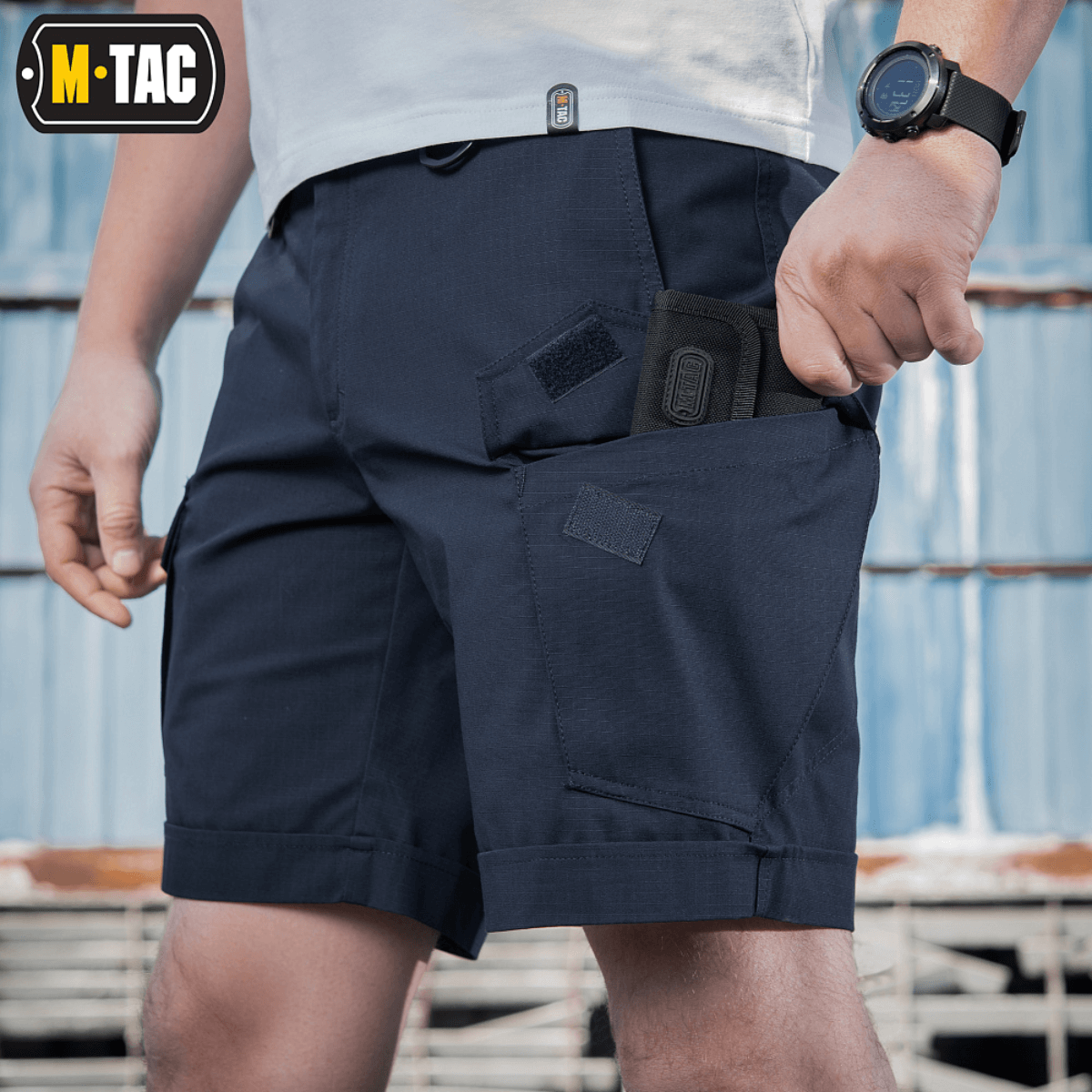 M-Tac Shorts Aggressor Short navy blå med taktiske lommer, ideel til varme dage og aktiv brug, fremstillet i elastisk polycotton material.