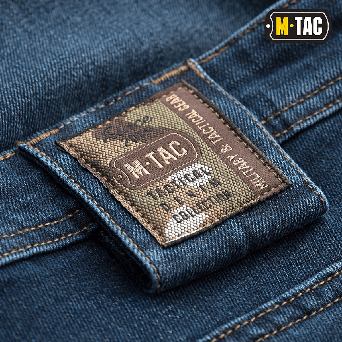 M-Tac Tactical Gen.I Regular Fit jeans med camouflagemærke på tæt skud af denimstof.