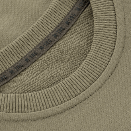 M-Tac Pullover 4 Seasons med elastisk rund hals, designad för allroundbruk. Tillverkad av 95% bomull och 5% elastan