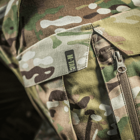 Nærbillede af M-Tac Bukser STURM NyCo Extreme Gen.II i camo mønster med Cordura 500D forstærkninger ved knæene.