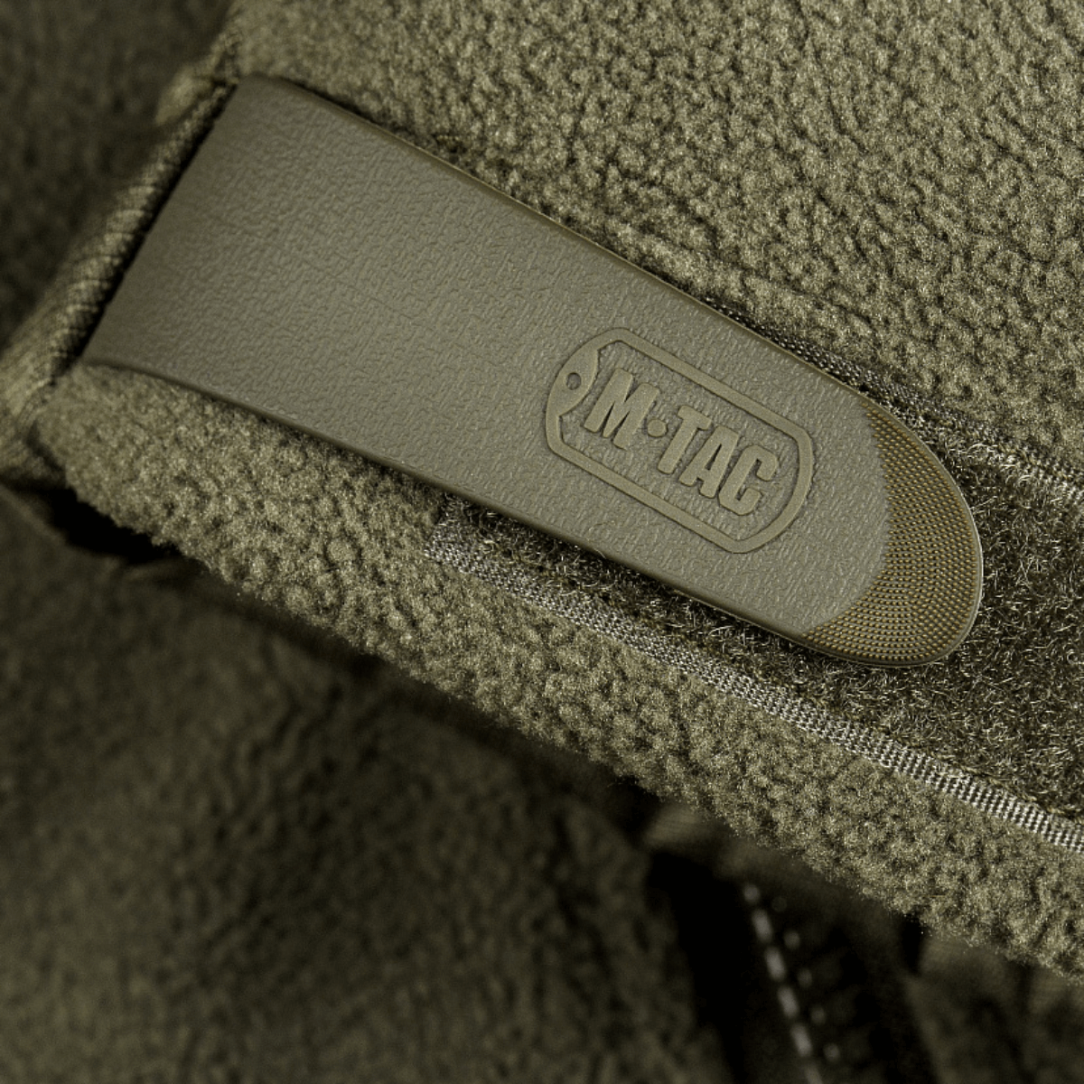 Nærbillede af detaljer på M-Tac Alpha Microfleece Jakke Gen.II med fleece og Oxford nylon forstærkninger.