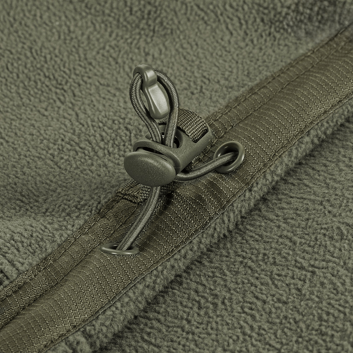 Detalje af M-Tac Division Gen.II Windblock Fleecejakke med snøre og lynlås i 100% polyester for optimal vindbeskyttelse.