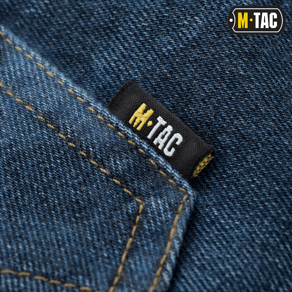 M-Tac Jeans Tactical Gen. I Cordura Regular Fit med holdbar Cordura Denim i nærbillede med M-Tac mærke.