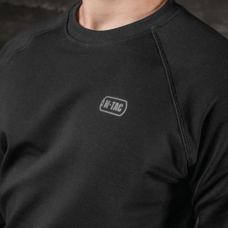 M-Tac Raglan Athlete i svart med raglanärm för maximal rörelsefrihet och komfort, idealisk för vardag och sport.