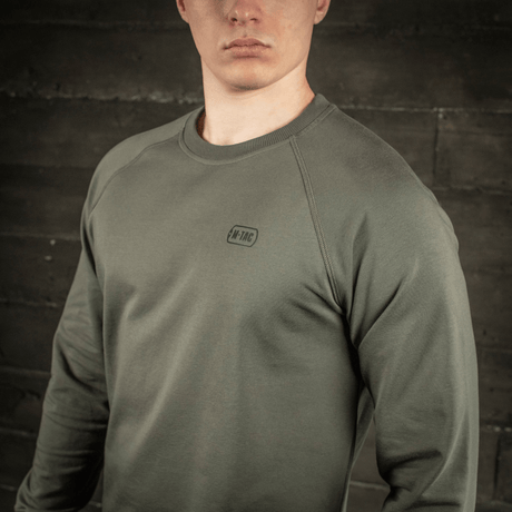 M-Tac Raglan Athlete sweatshirt i oliv med raglanärmar och rund hals. Idealisk för sport och vardagsbruk, material: bomull och elastan.