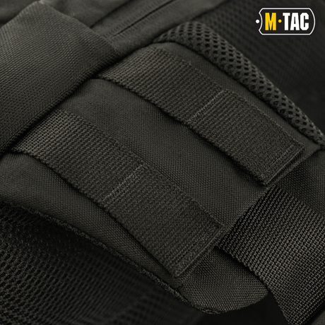 M-Tac Buckler Taske Elite med MOLLE-system i svart Cordura 500D, nära visning av design och remmar.