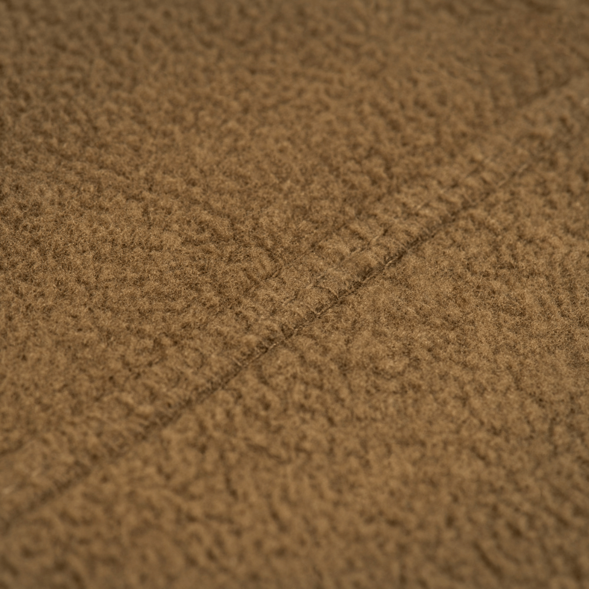 Close-up view of M-Tac Fleece Neck Gaiter med Snor material showcasing brown fleece texture.