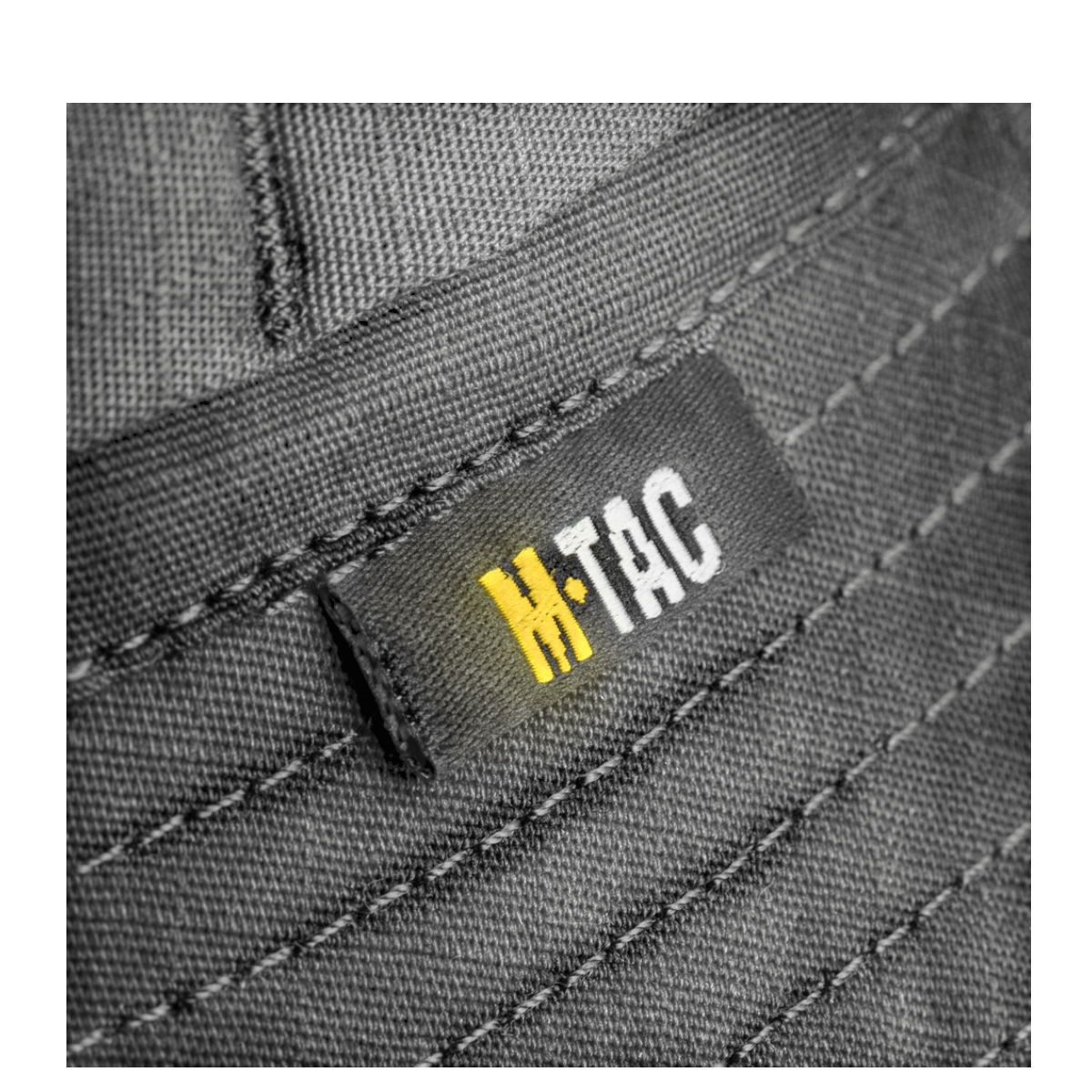 Nærbillede af M-Tac Panamahat Gen. II Flex Rip-Stop i slidstærkt rip-stop stof med skjulte syninger, perfekt til varme sommerdage.