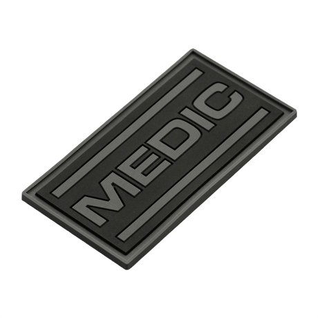 M-Tac Patch Medic PVC 3D taktisk patch med Velcro, med svart design och 3D-effekt. Mått: 70 x 35 mm. Perfekt för uniformer och väskor.
