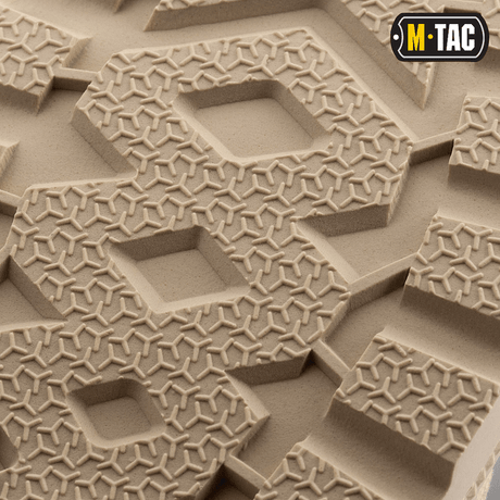 Detalje af M-Tac Sneakers ydersål med stødabsorbering og godt greb, ideelle til udendørs aktiviteter og sport.