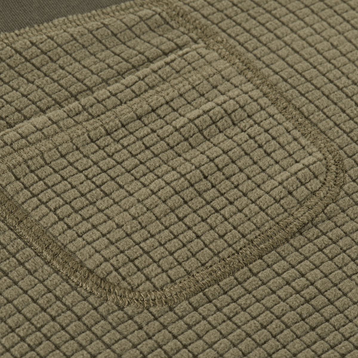 Detalje af fleece stof på M-Tac Fleece Termobukser Delta Level 2 Lady, viser tekstur og lommedesign.