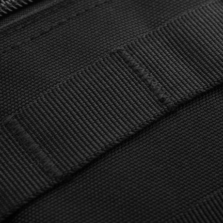 Närbild av M-Tac Urban Line City Patrol Fastex väska med slitstark polyester och PVC-coating.