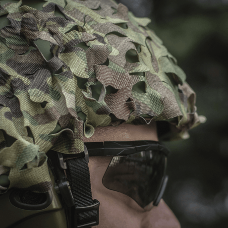M‑Tac Vilha Hjelmdæksel Elite i MULTICAM-camouflage på FAST hjelm, beskytter mod snavs og slid. Cordura 500D og Laser Cut mesh.