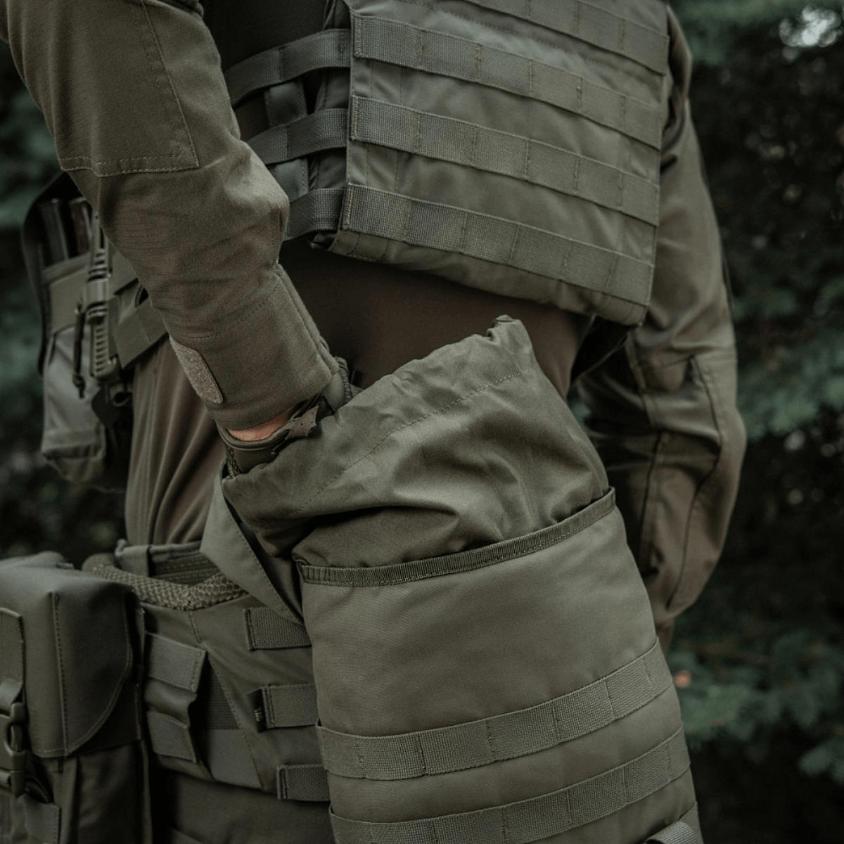Soldier using M-Tac Sukharka Gen.3 Pouch with MOLLE attachment on field gear