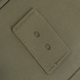 Nærbillede af grøn tekstur med trækhuller