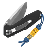 M-Tac Lanyard Scandinavian Small Chinese Knot på en sort kniv med skandinavisk perle dekoration.