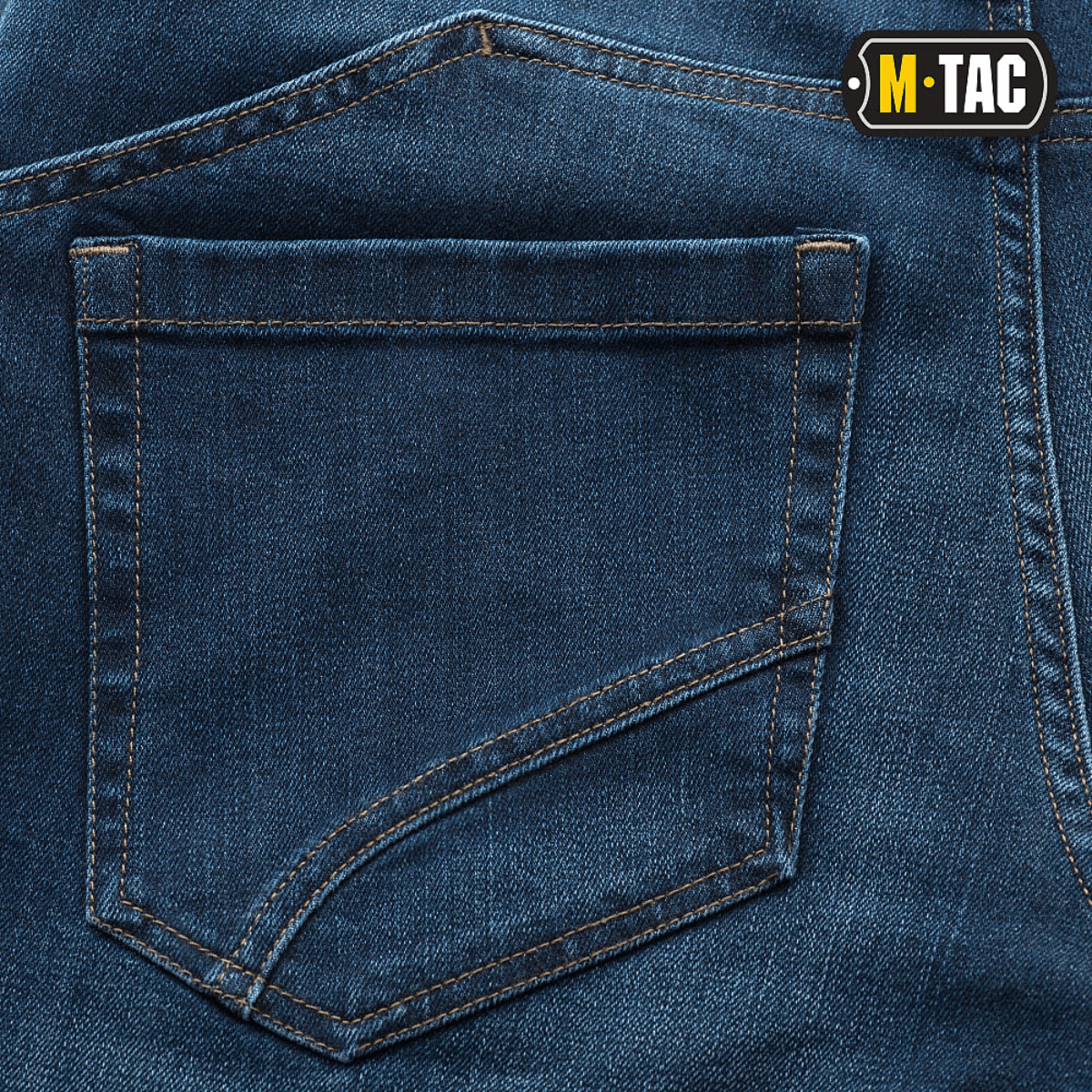M-Tac Tactical Gen.I Regular Fit jeans, close-up view of back pocket design, blue denim texture, dansk.