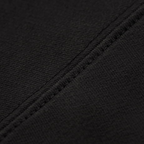 Nærbillede af M-Tac Pullover 4 Seasons stoftekstur, 95% bomuld og 5% elastan med strækfast syning, ideel til helårsbrug.