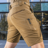 M-Tac Shorts Rubicon Flex i mørk oliven med cargo-lommer og YKK lynlåse, designet til sommer med stretch og vandafvisende materiale.