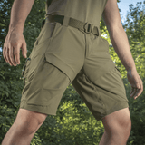 M-Tac Shorts Rubicon Flex i mørk oliven med specielle cargo-lommer, ideelle til sommer, designet med 4-vejs stræk og vandafvisende materiale.