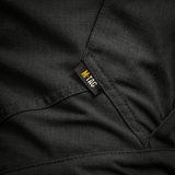 Detalje af M-Tac Bukser STURM NyCo Extreme Gen.II med robust syning og mærke. Materiale NYCO Extreme for holdbarhed og komfort.