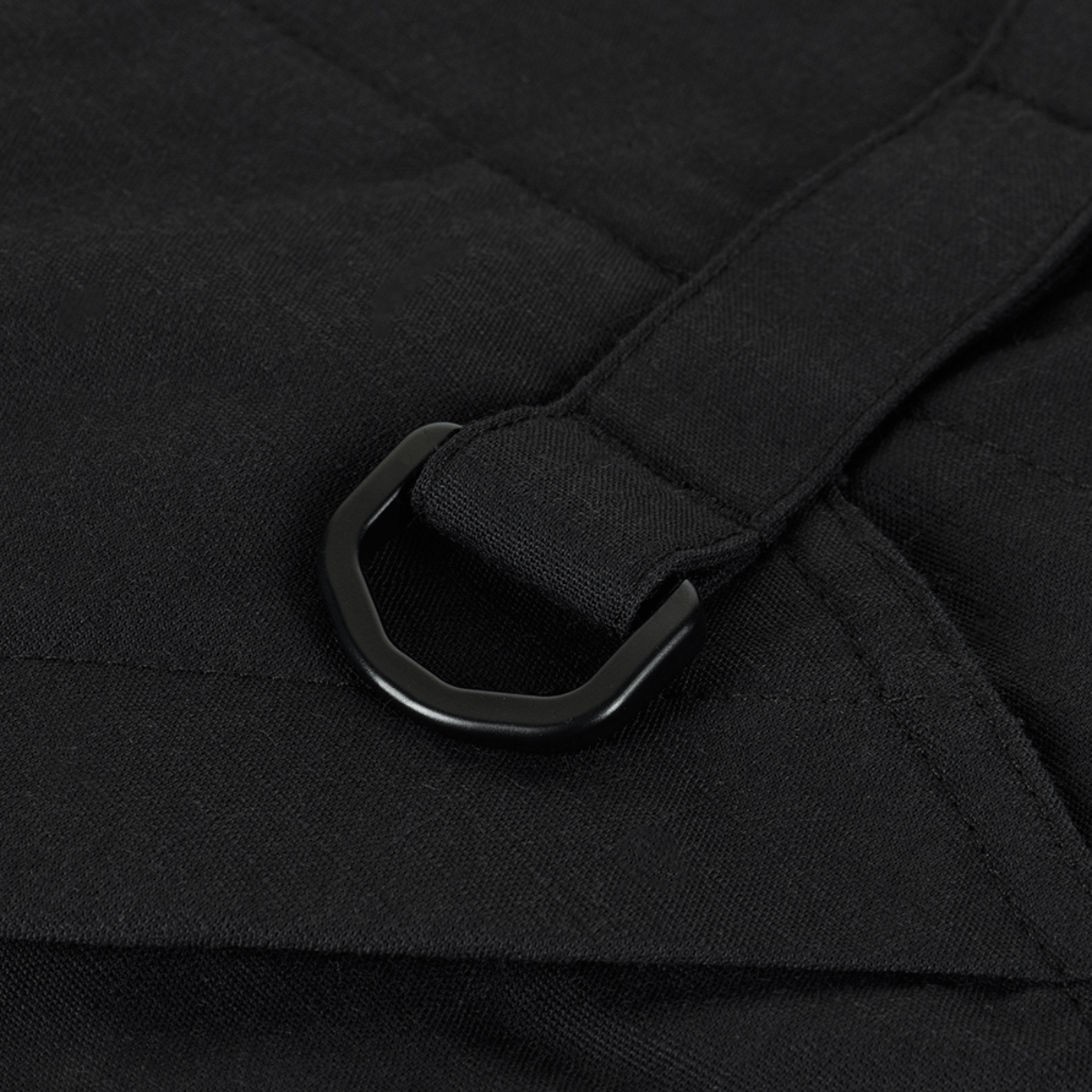 Detalje af bæltestrop på taktiske M-Tac Bukser STURM NyCo Extreme Gen.II i sort nylon og bomuldsmateriale.