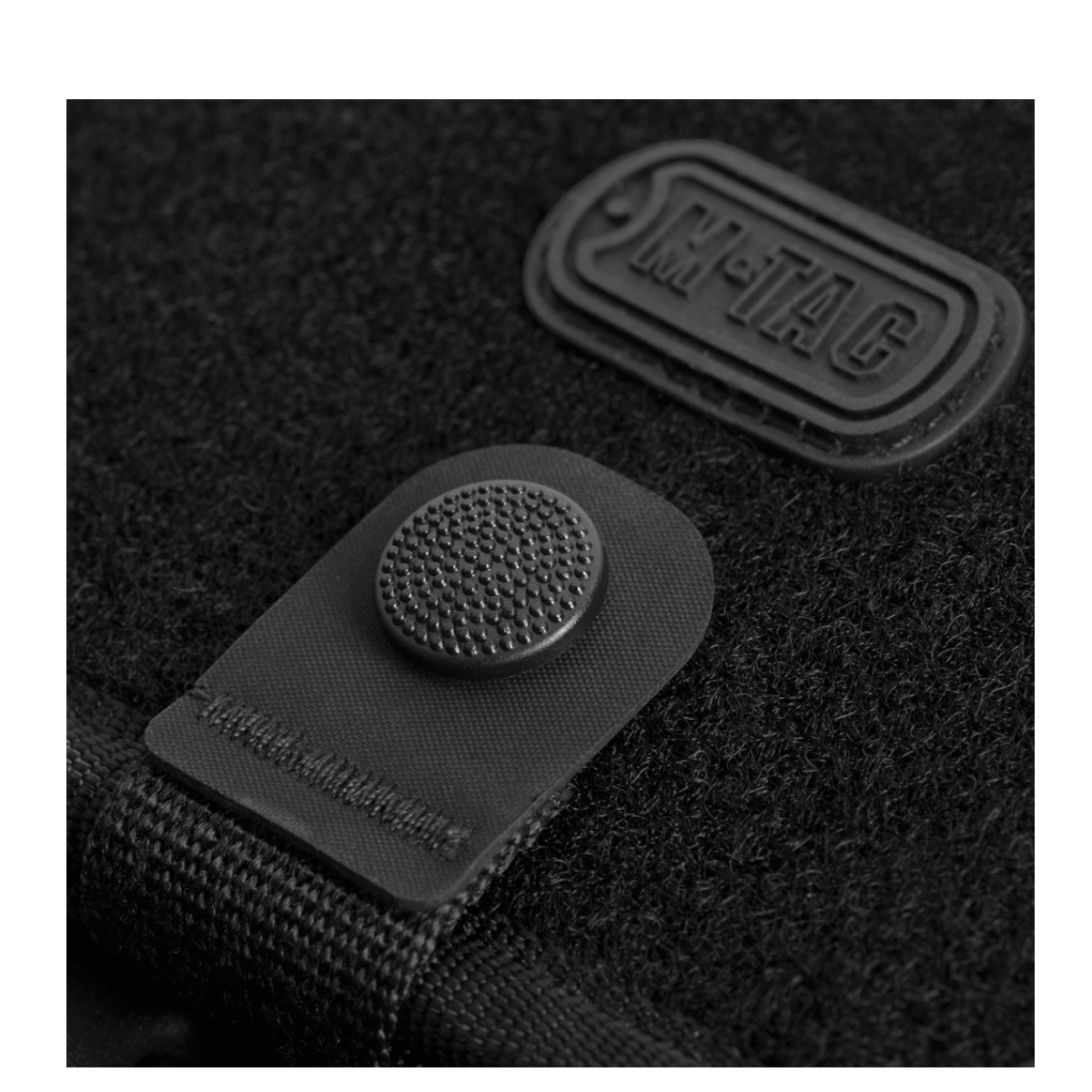 M-Tac Pung med Patch Panel Elite Large - nærbillede af knap og velcro-loop panel på 1000D CORDURA® materiale, praktisk og holdbar.