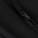 Nærbillede af lynlås på M-Tac Alpha Gen.III Pro Vinterjakke, fremviser holdbar sort vandtæt nylonmateriale.