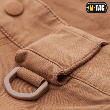 Nærbillede af M-Tac Bukser Aggressor Vintage med kraftigt bomuldsstof og praktisk lomme, velegnet til både hverdagsbrug og feltarbejde.